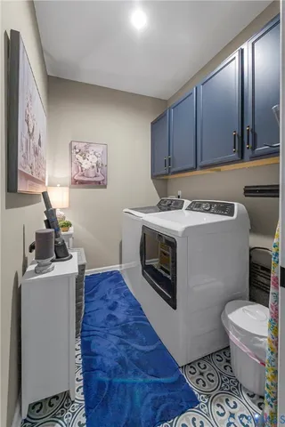 a room with a stove and a refrigerator