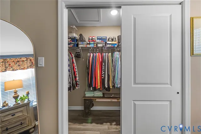 a bedroom with a bed and flat screen tv