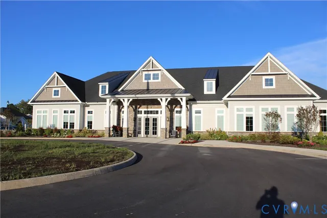 a room with pool table and windows