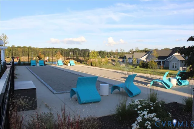 a view of a patio with table and chairs