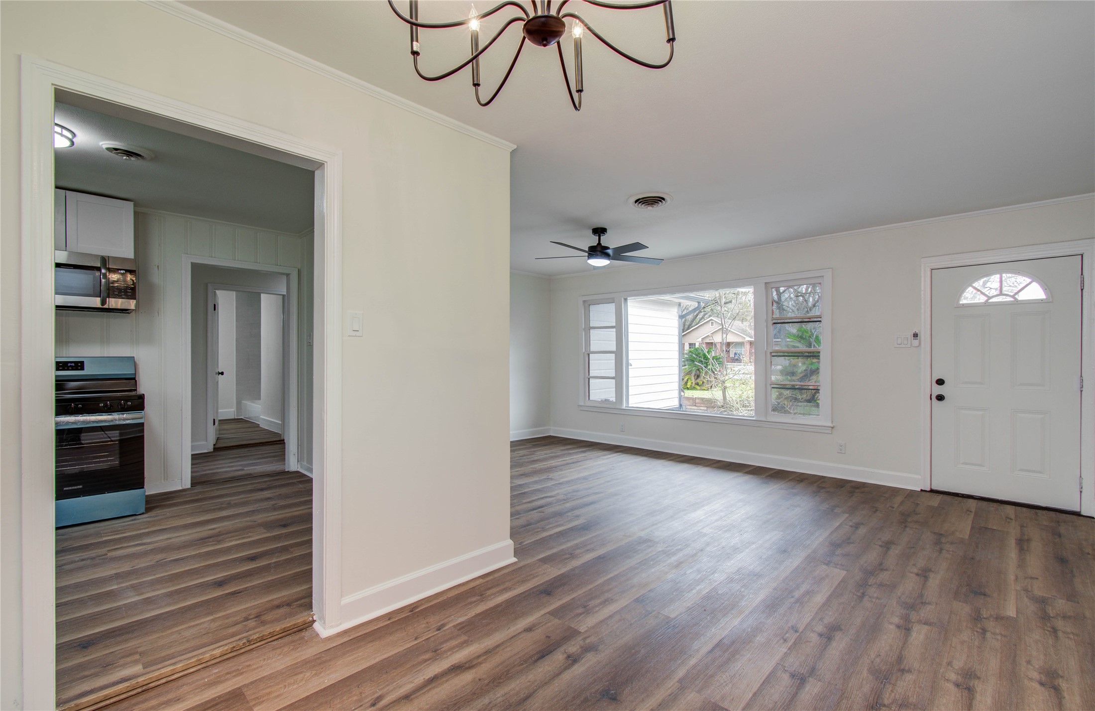 2417 Pecan Street Dickinson, TX 77539 - Photo 26 of 43 a view of empty room with wooden floor and fan
