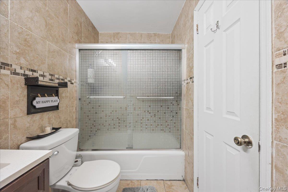 782 Tuckahoe Road, Unit 3C Yonkers, NY 10710 - Photo 12 of 19 a bathroom with a bathtub shower sink mirror and toilet