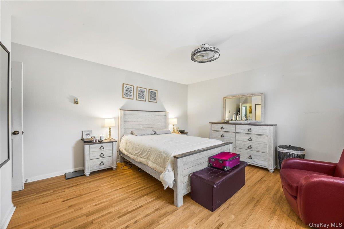 782 Tuckahoe Road, Unit 3C Yonkers, NY 10710 - Photo 14 of 19 a bedroom with a bed and a couch