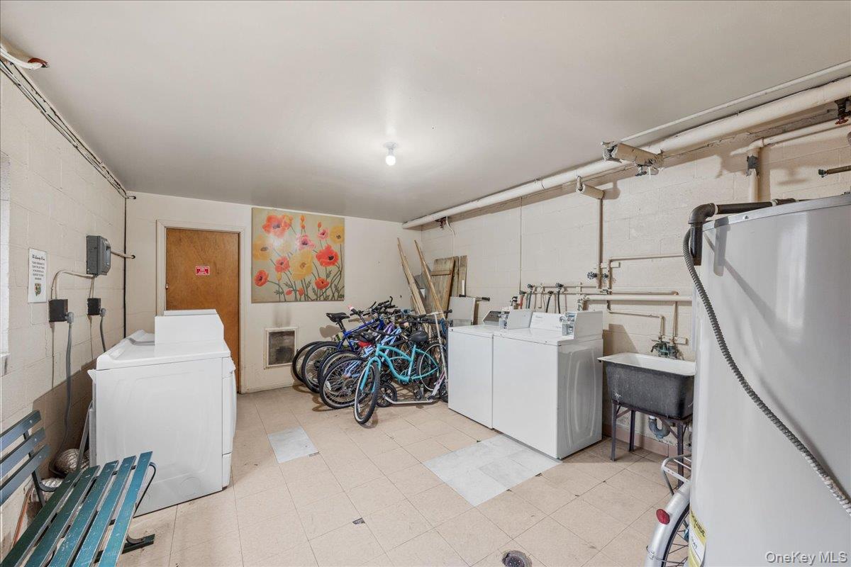 782 Tuckahoe Road, Unit 3C Yonkers, NY 10710 - Photo 17 of 19 a storage room with washer and dryer