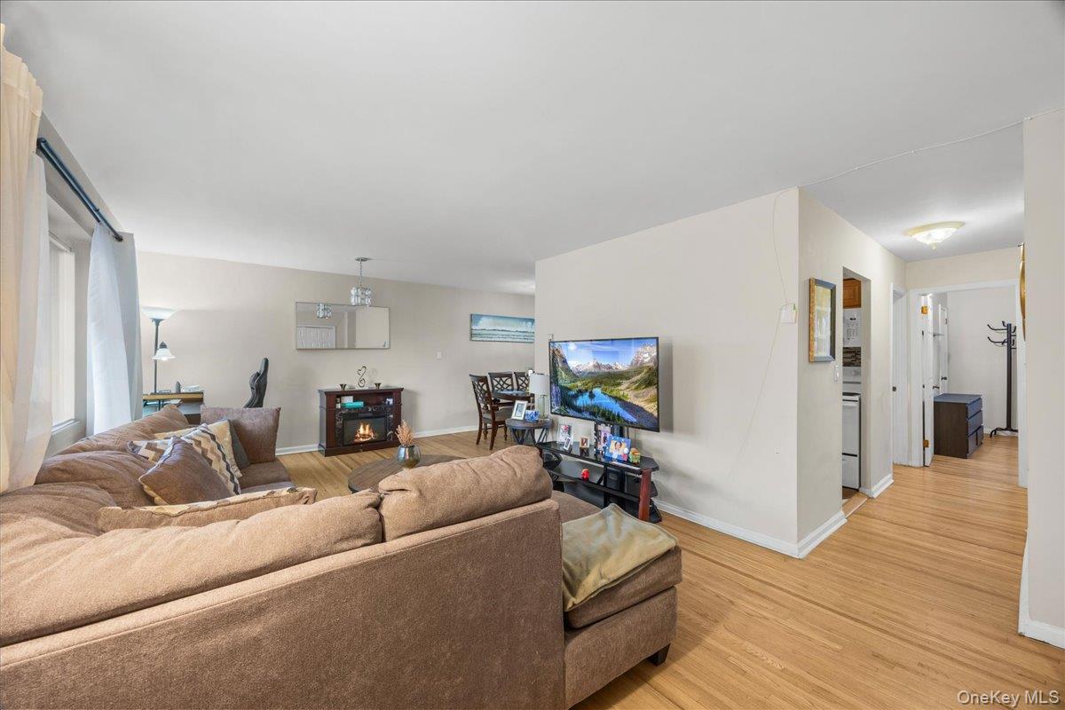 782 Tuckahoe Road, Unit 3C Yonkers, NY 10710 - Photo 2 of 19 a living room with furniture and a flat screen tv