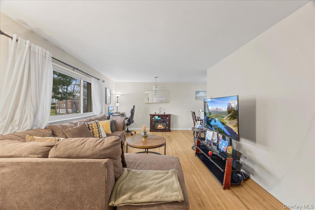 782 Tuckahoe Road, Unit 3C Yonkers, NY 10710 - Photo 3 of 19 a living room with furniture and a flat screen tv