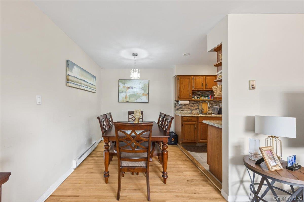 782 Tuckahoe Road, Unit 3C Yonkers, NY 10710 - Photo 6 of 19 a view of a dining room with furniture and wooden floor