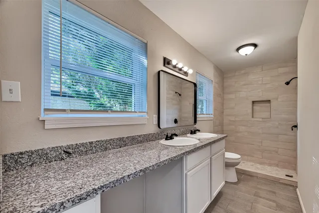 an empty room with wooden floor and closet