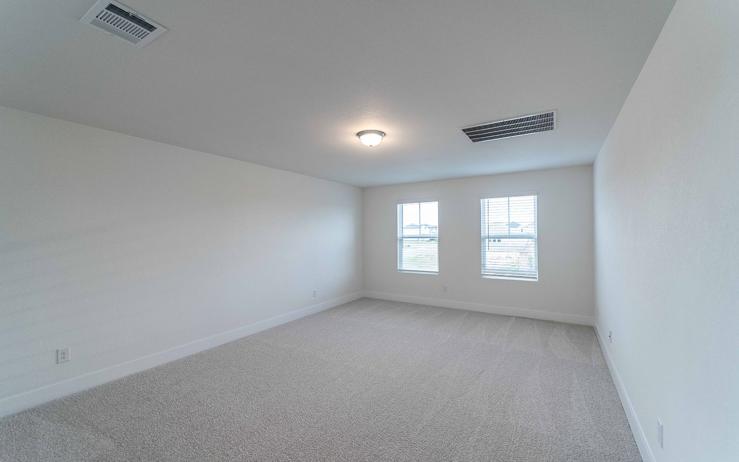 104 Old Silver Drive Jarrell, TX 76537 - Photo 12 of 19 Spare room with light carpet and baseboards