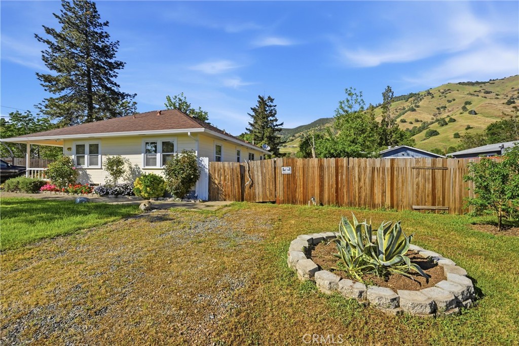 3440 Beach Nice, CA 95464 - Photo 18 of 27 a view of a house with backyard and sitting area