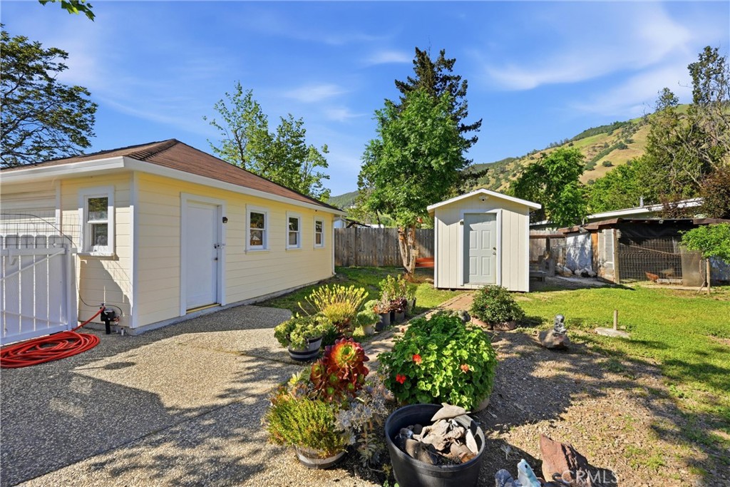 3440 Beach Nice, CA 95464 - Photo 24 of 27 a front view of a house with a yard