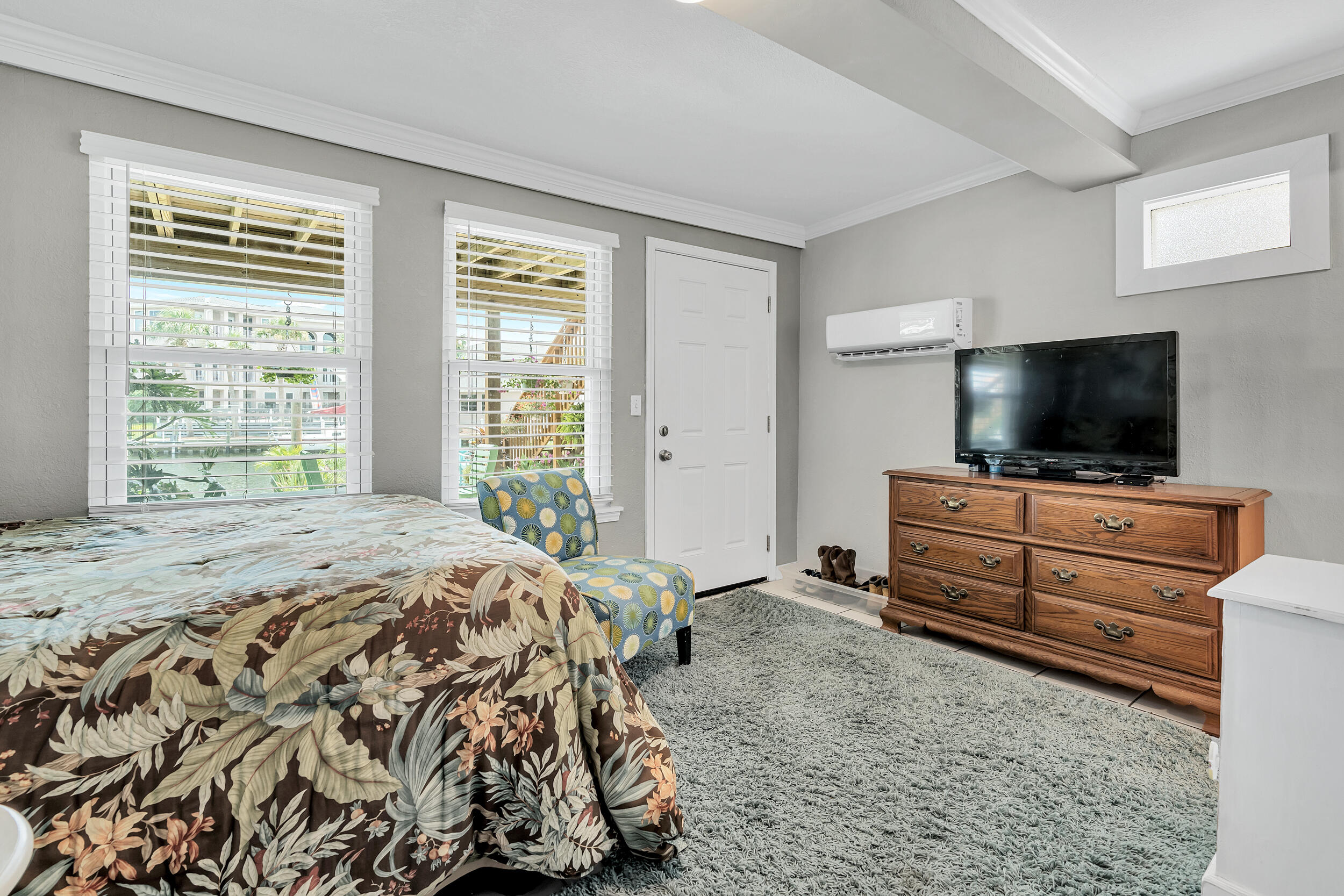 153 Durango Road Destin, FL 32541 - Photo 30 of 51 a bedroom with a bed and flat screen tv