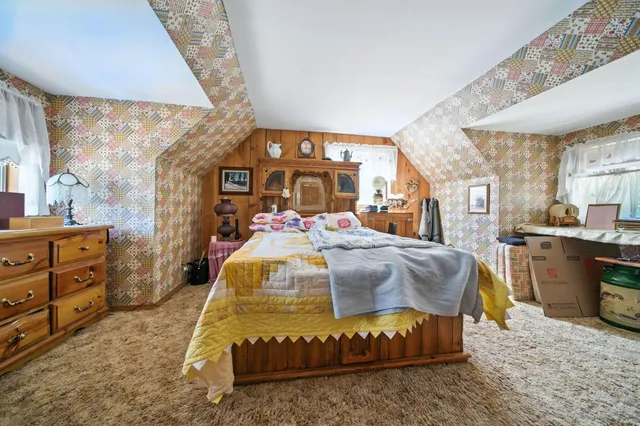 a bathroom with a granite countertop toilet sink and mirror