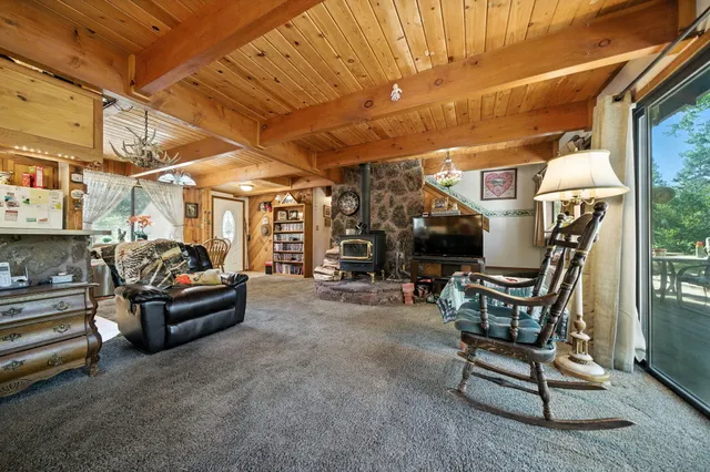 a view of living room with couch and chairs