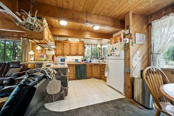 a stove top oven sitting inside of a kitchen