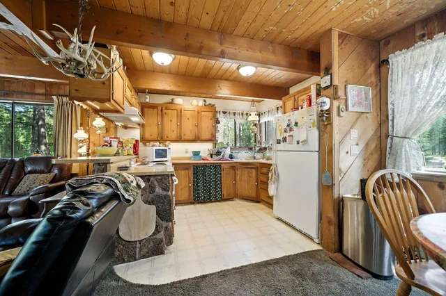 a stove top oven sitting inside of a kitchen