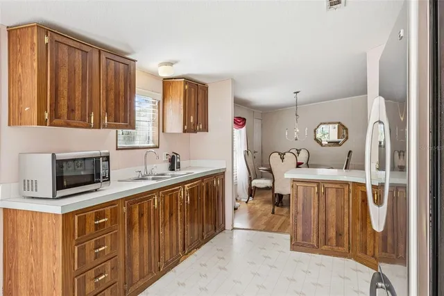 a kitchen with stainless steel appliances a refrigerator and a stove