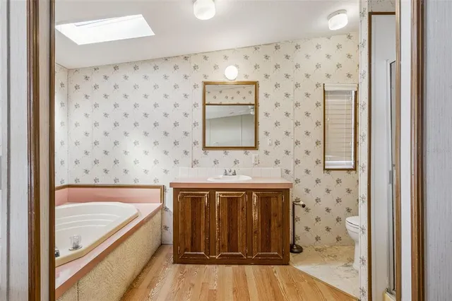 a bathroom with a bathtub and a sink