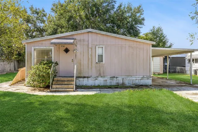 a view of a back yard of the house
