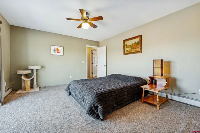 a bedroom with a bed and a table in it