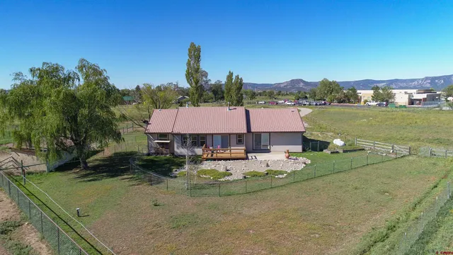 a view of a house with chair and table