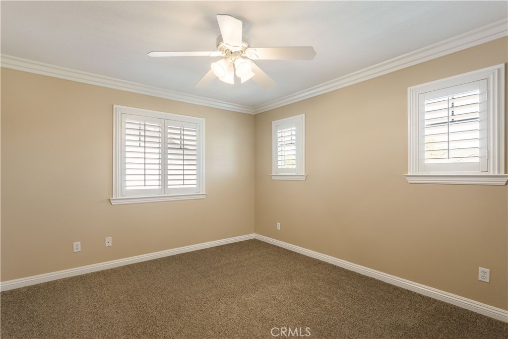 33351 Nicholas Common Temecula, CA 92592 - Photo 25 of 42 an empty room with windows and fan