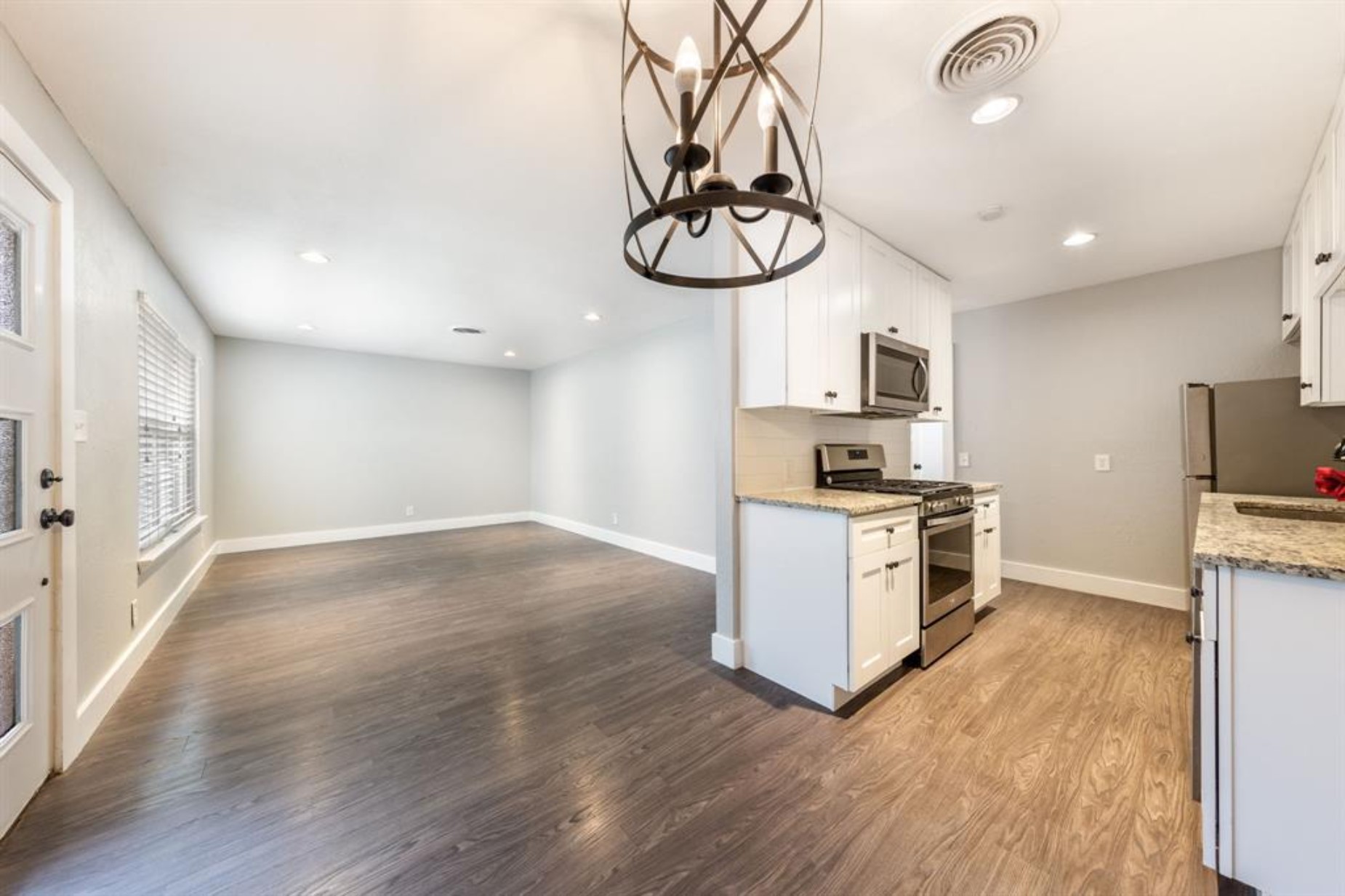 1423 Braes Ridge Drive, Unit B Austin, TX 78723 - Photo 5 of 13 a kitchen with a refrigerator and a stove top oven