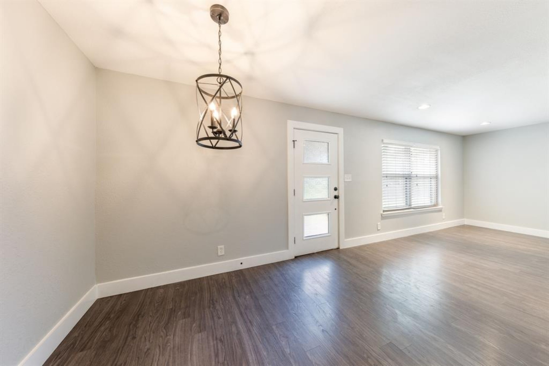 1423 Braes Ridge Drive, Unit B Austin, TX 78723 - Photo 6 of 13 a view of a room with wooden floor and windows