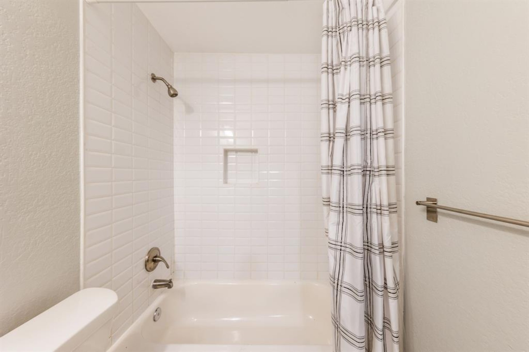 1423 Braes Ridge Drive, Unit B Austin, TX 78723 - Photo 10 of 13 a bathroom with a bathtub and shower