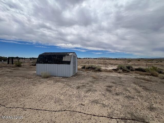 770 Butte View Fallon, NV 89406 - Photo 2 of 8 a view of a dry yard with wooden fence