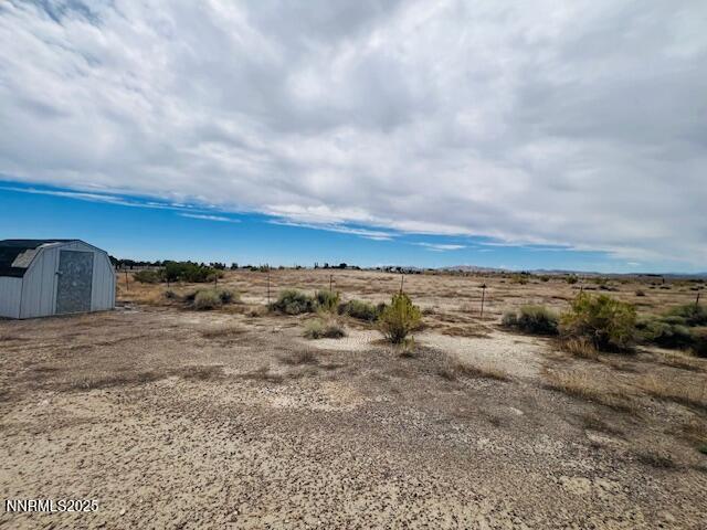 770 Butte View Fallon, NV 89406 - Photo 4 of 8 a view of a dry yard with wooden fence