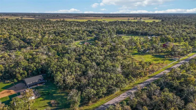 a view of a city with green field