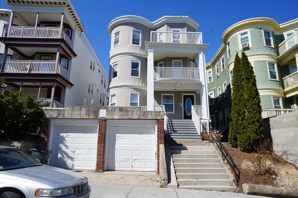 91 Claybourne Street Boston, MA 02124 - Photo 1 of 1 a front view of a house with a garden
