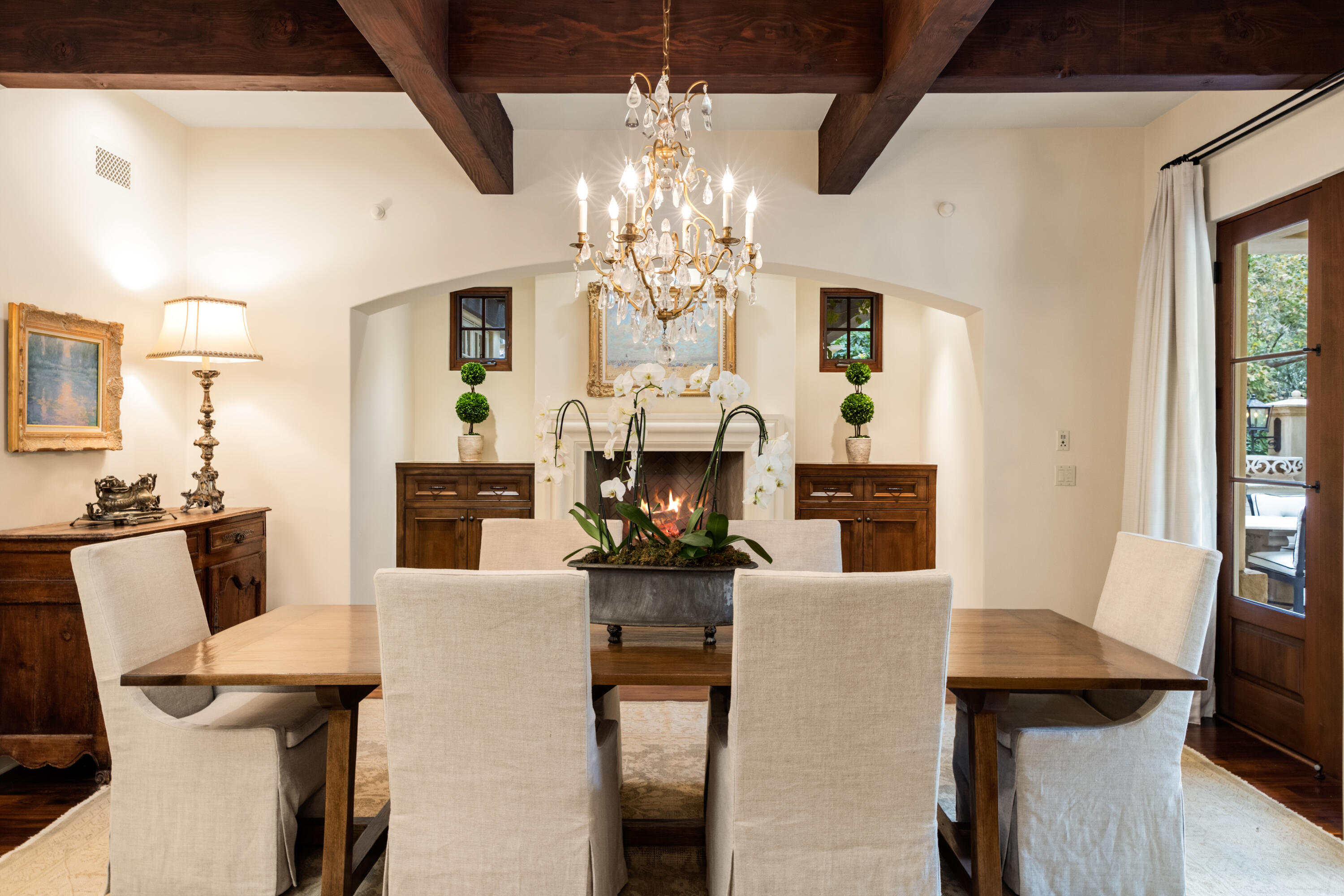 2035 Creekside Road Montecito, CA 93108 - Photo 15 of 60 a living room with fireplace furniture and a chandelier