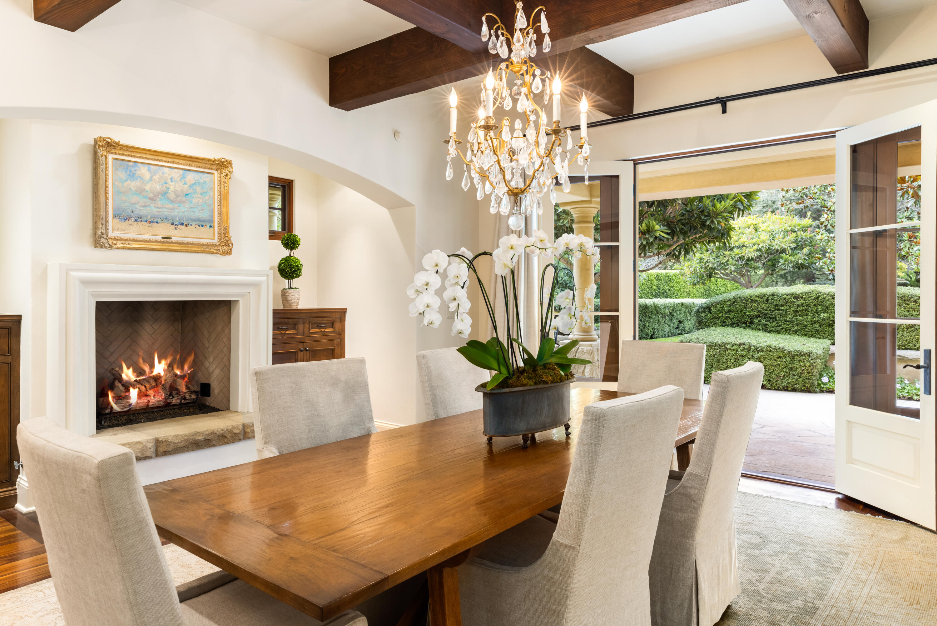 2035 Creekside Road Montecito, CA 93108 - Photo 16 of 60 a living room with furniture a chandelier and a fireplace