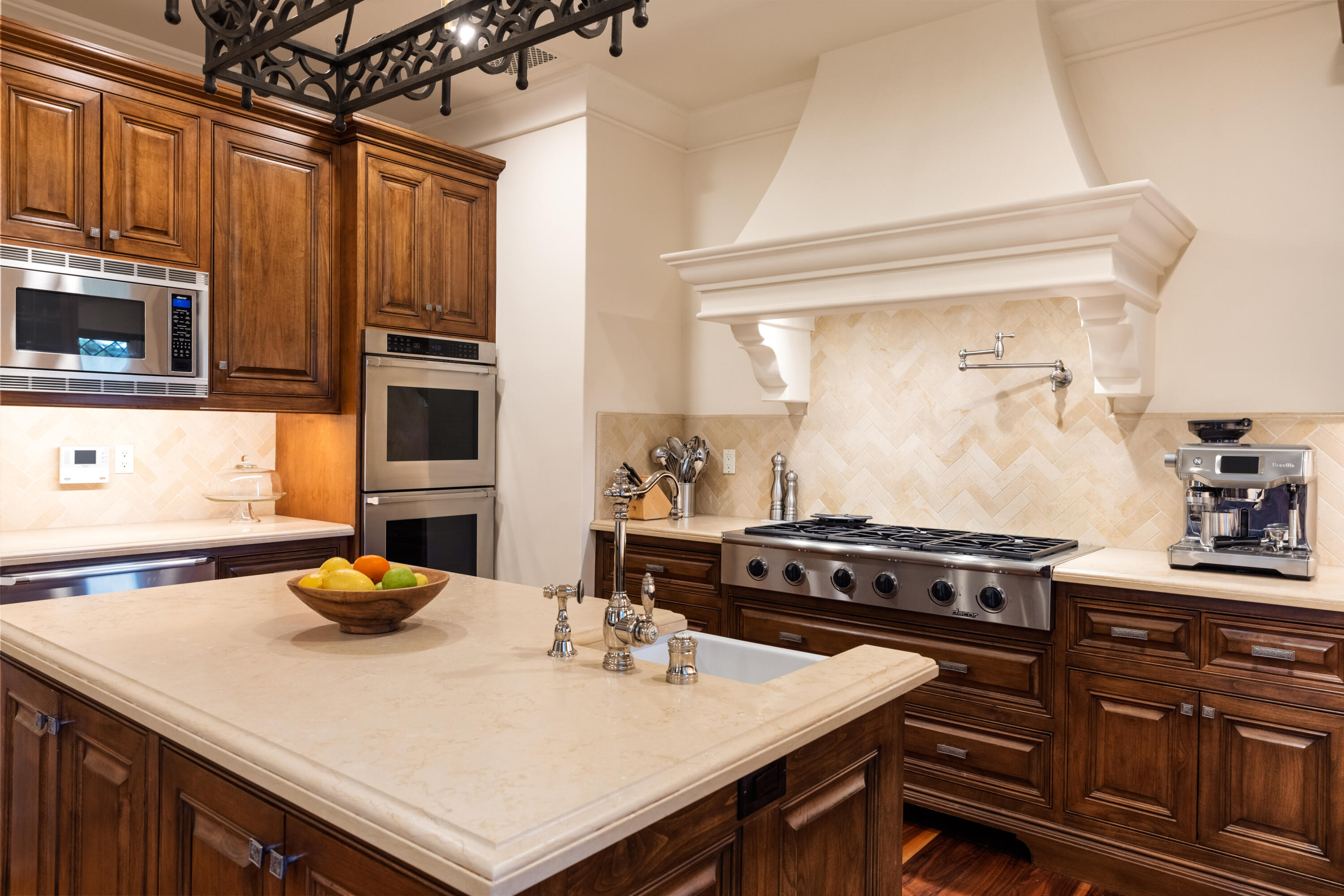 2035 Creekside Road Montecito, CA 93108 - Photo 25 of 60 a kitchen with stainless steel appliances a stove a sink cabinets and wooden floor