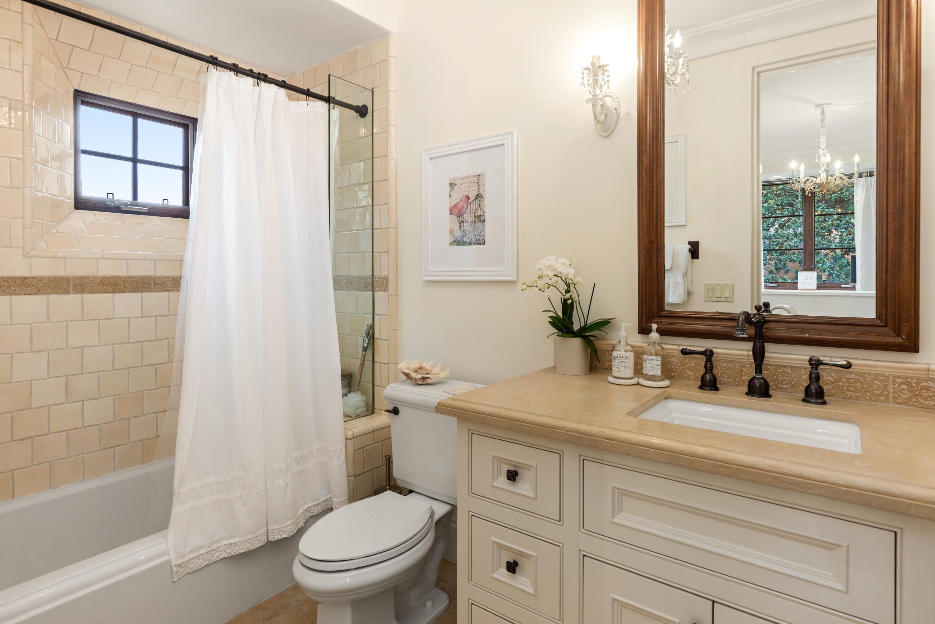 2035 Creekside Road Montecito, CA 93108 - Photo 32 of 60 a bathroom with a granite countertop sink toilet and shower