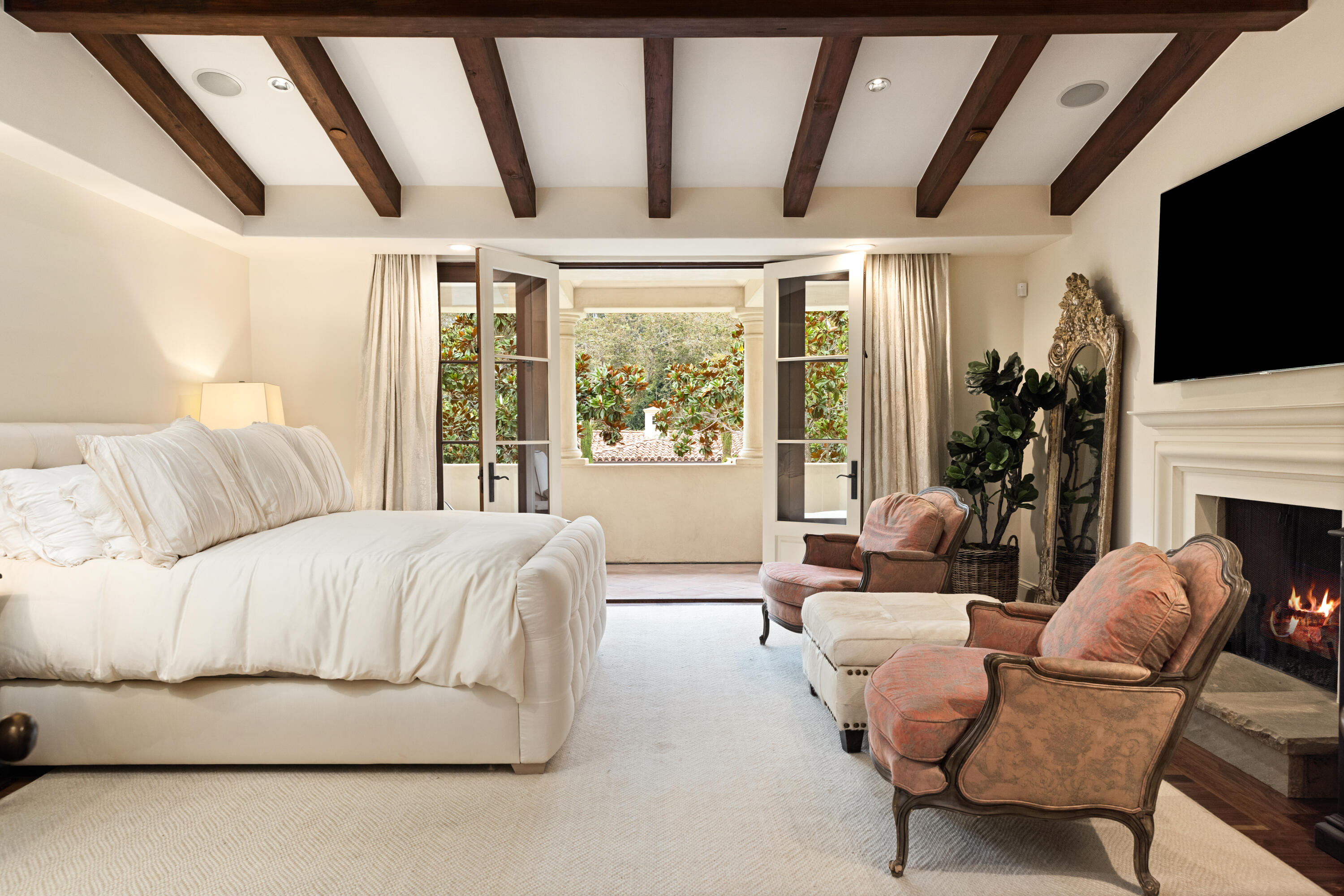 2035 Creekside Road Montecito, CA 93108 - Photo 33 of 60 a living room with furniture fireplace and flat screen tv