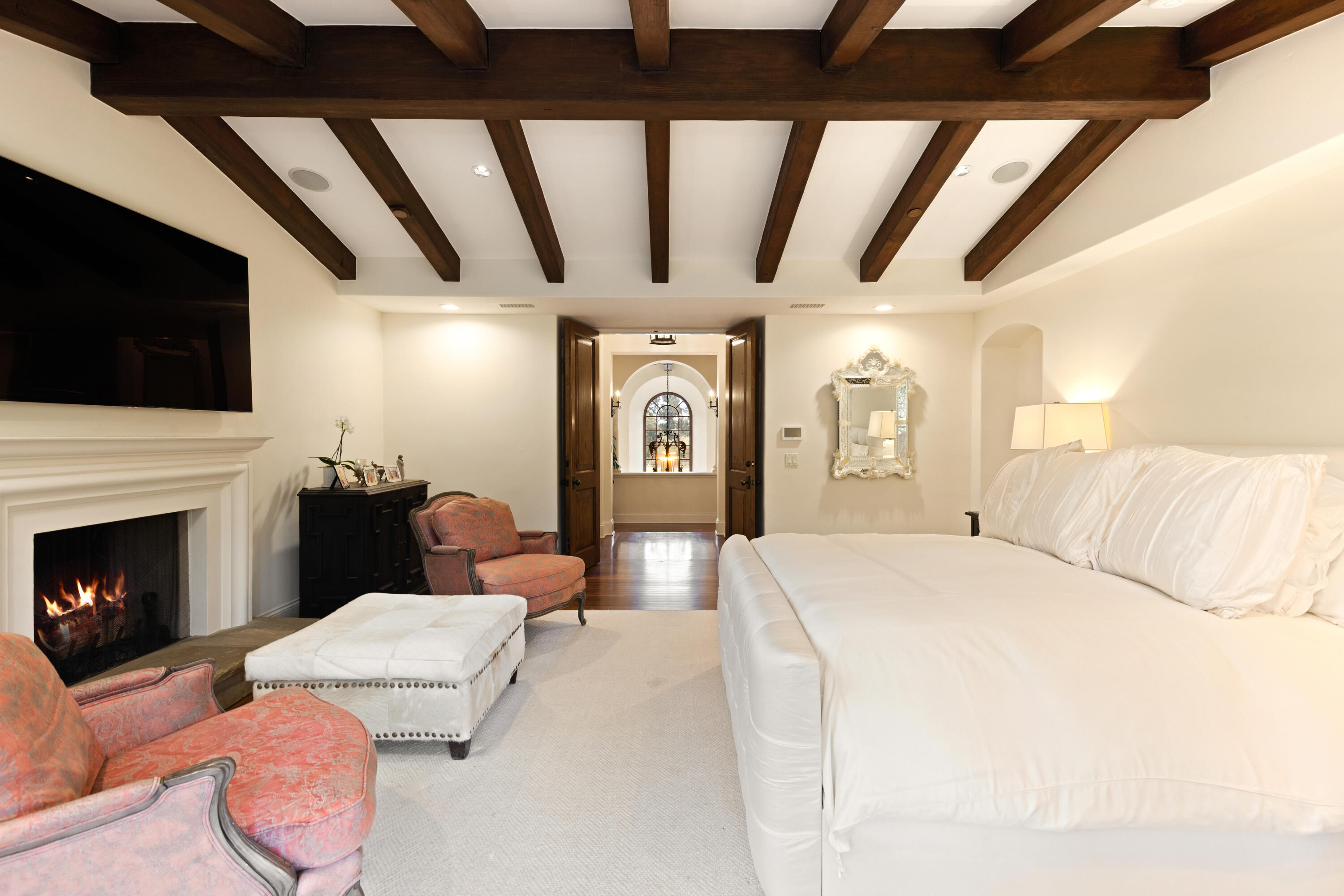 2035 Creekside Road Montecito, CA 93108 - Photo 34 of 60 a spacious bedroom with a bed a flat screen tv and next to a window