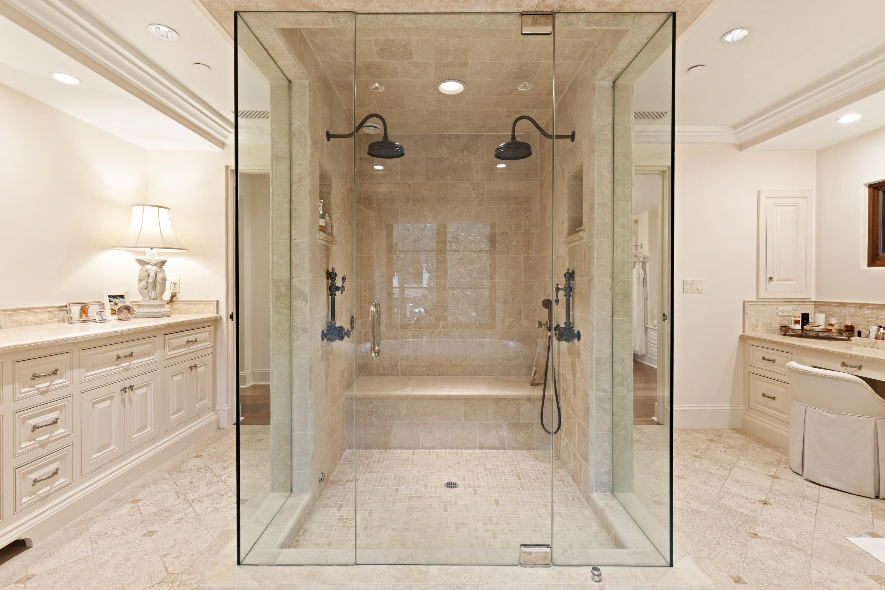 2035 Creekside Road Montecito, CA 93108 - Photo 37 of 60 a bathroom with a granite countertop sink a mirror and a shower