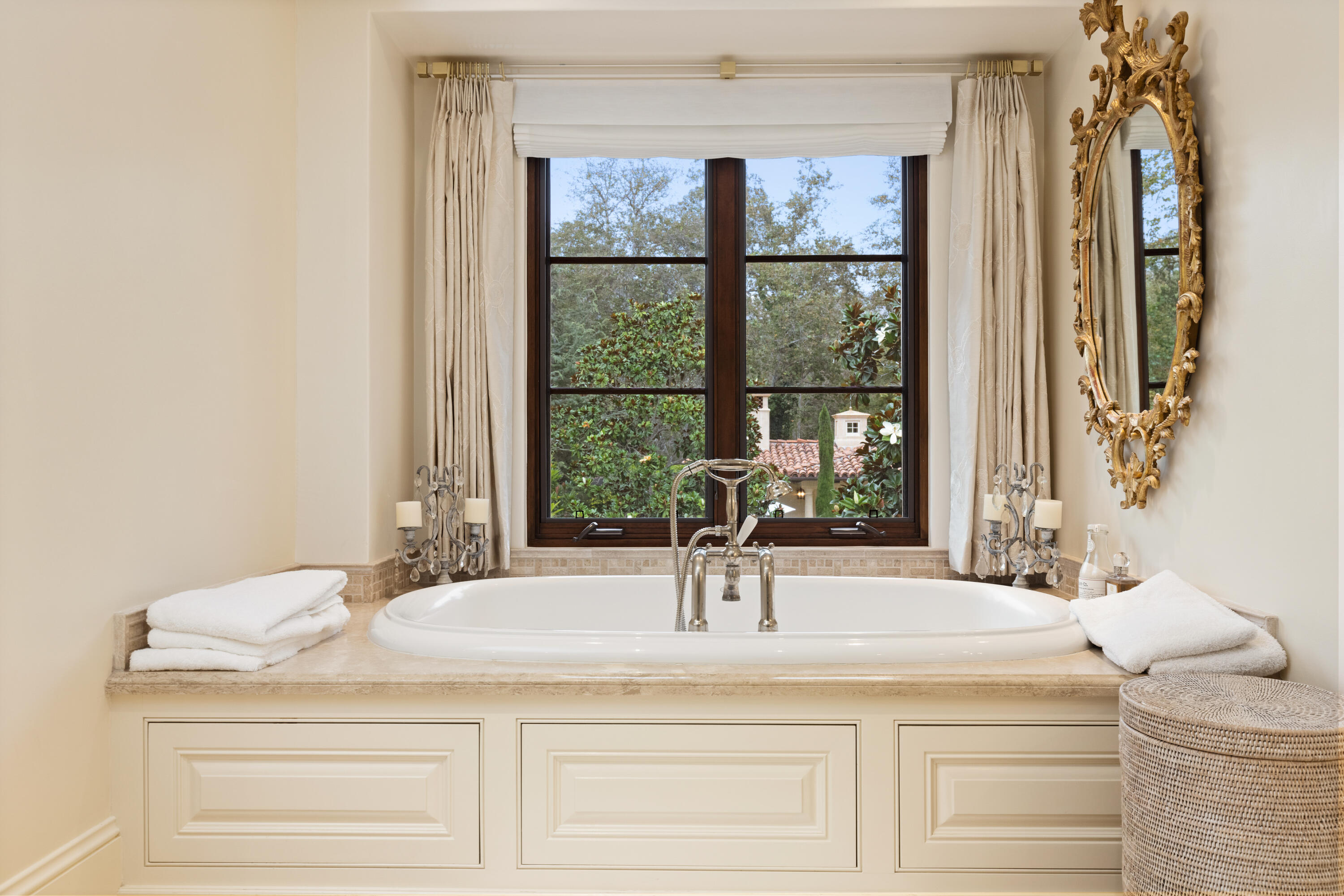 2035 Creekside Road Montecito, CA 93108 - Photo 38 of 60 a bathroom with a sink and a large mirror