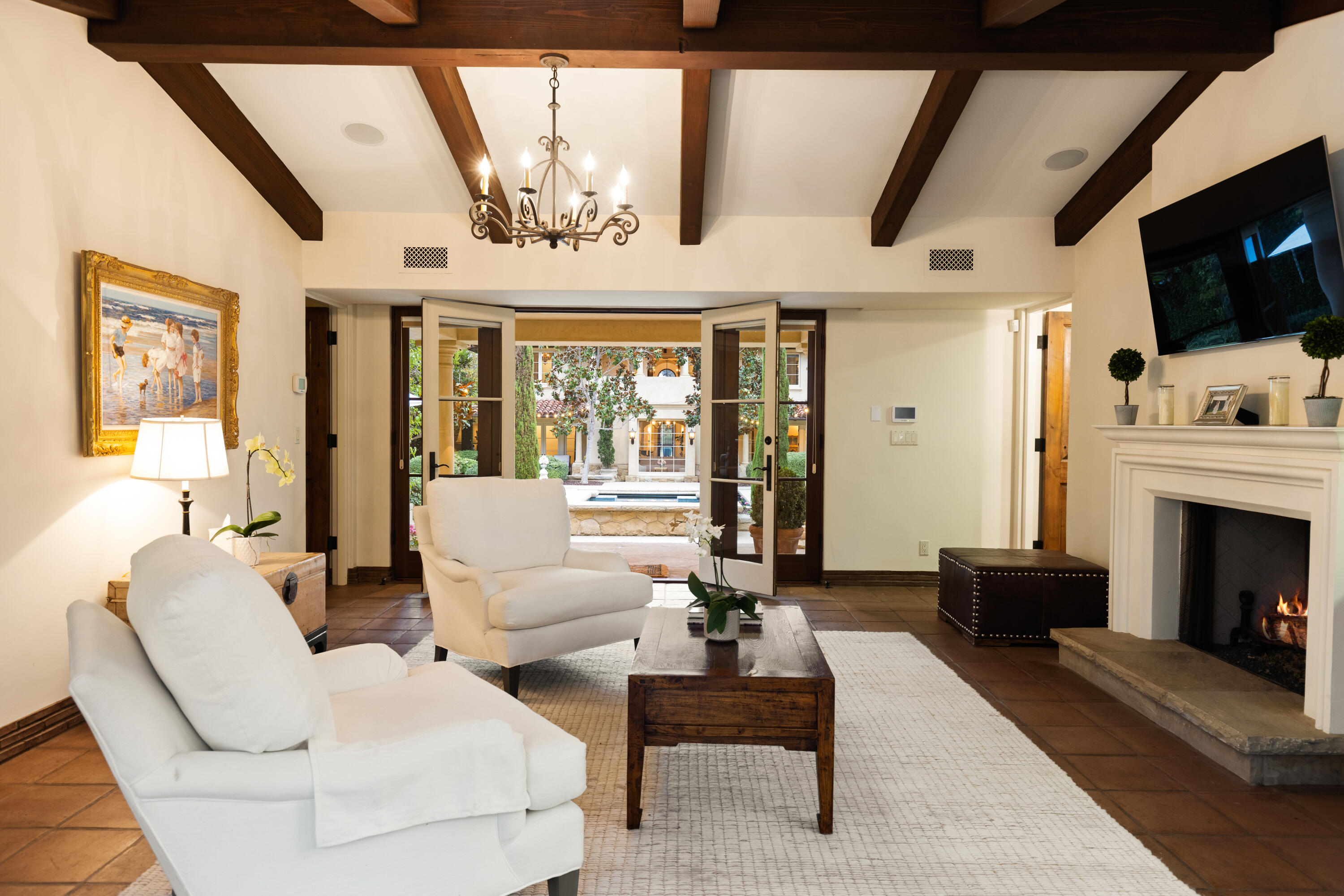 2035 Creekside Road Montecito, CA 93108 - Photo 49 of 60 a living room with furniture fireplace and flat screen tv