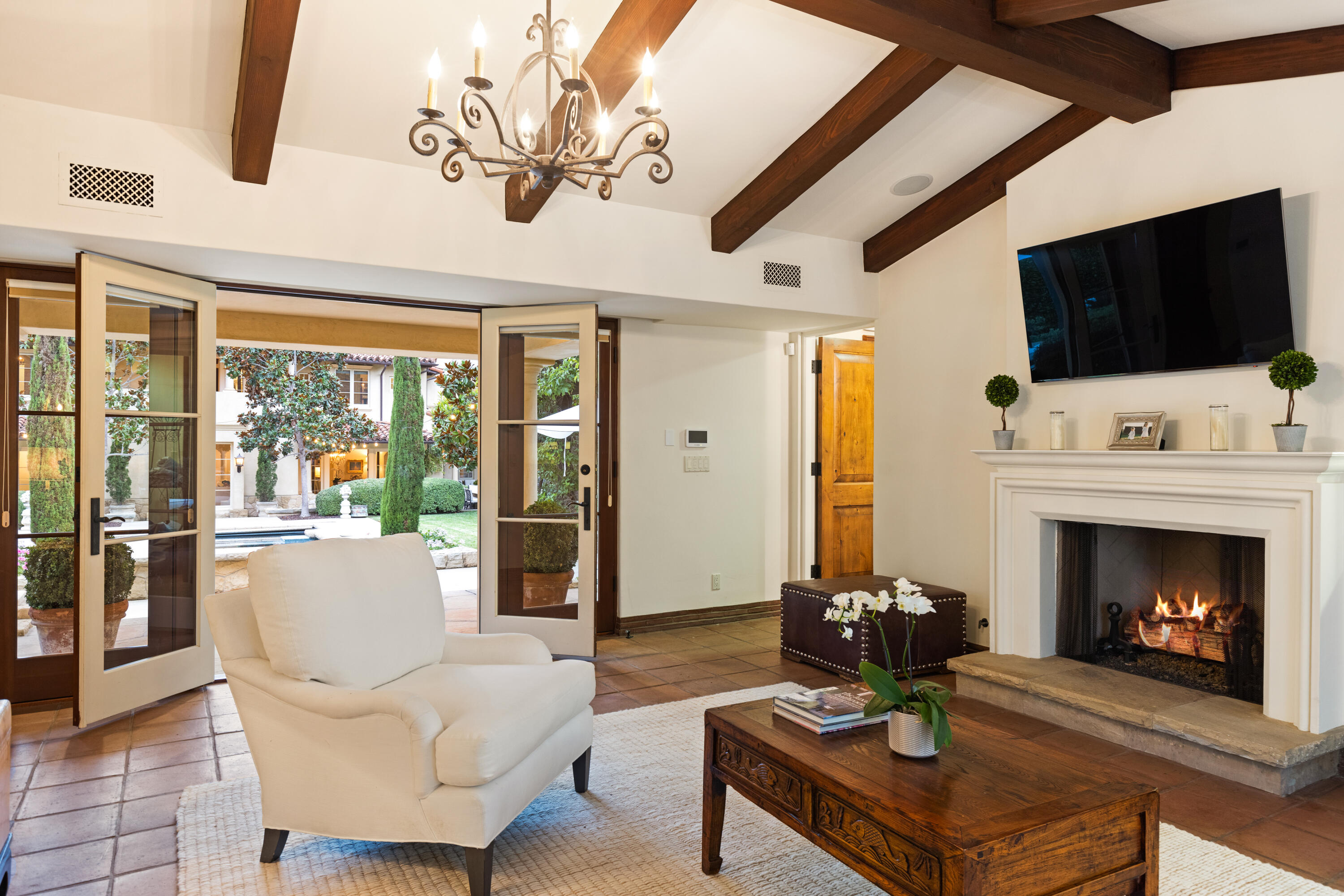 2035 Creekside Road Montecito, CA 93108 - Photo 50 of 60 a living room with furniture a flat screen tv and a fireplace