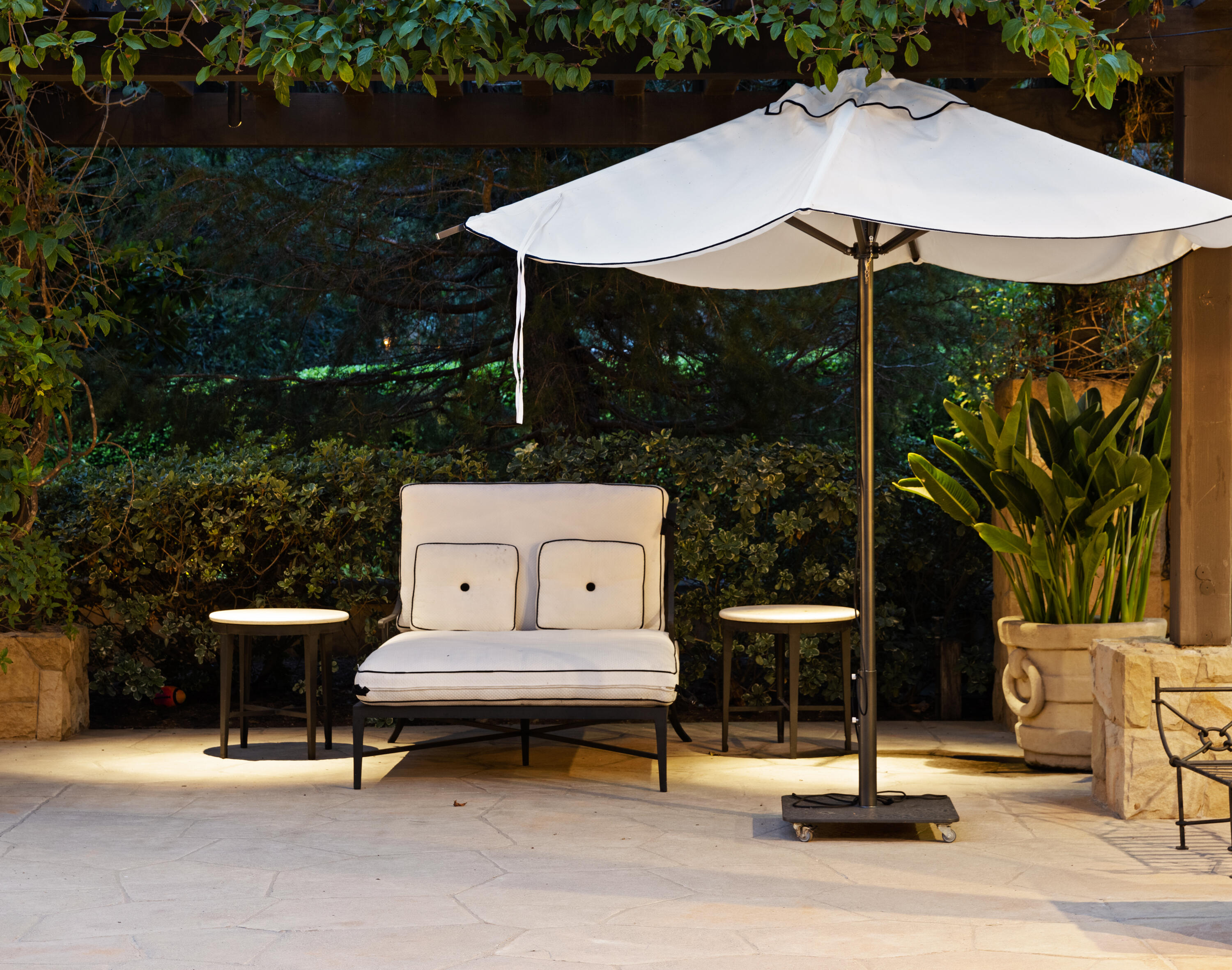 2035 Creekside Road Montecito, CA 93108 - Photo 58 of 60 a view of a patio with table and chairs under an umbrella