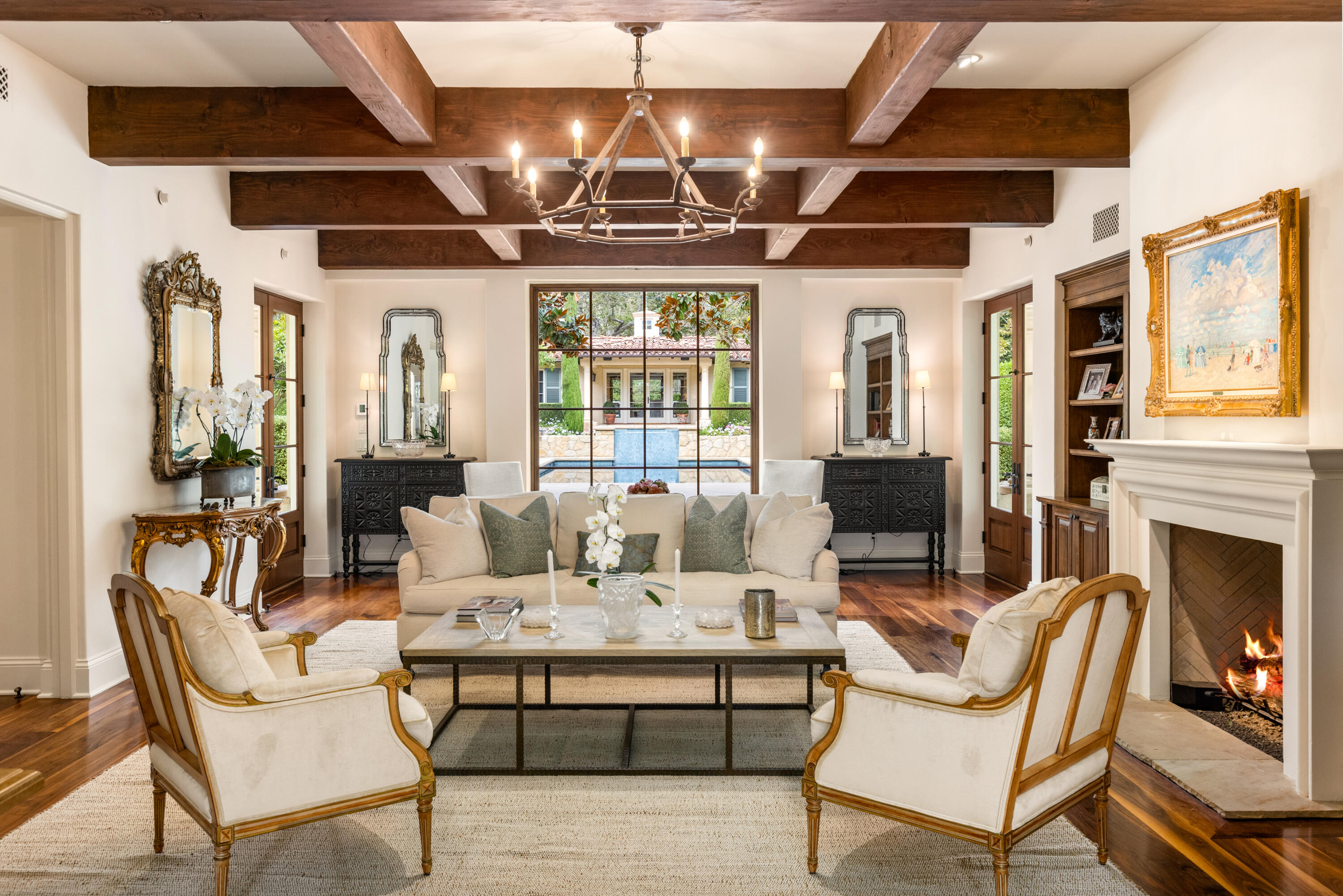 2035 Creekside Road Montecito, CA 93108 - Photo 9 of 60 a dining room with furniture a fireplace and wooden floor