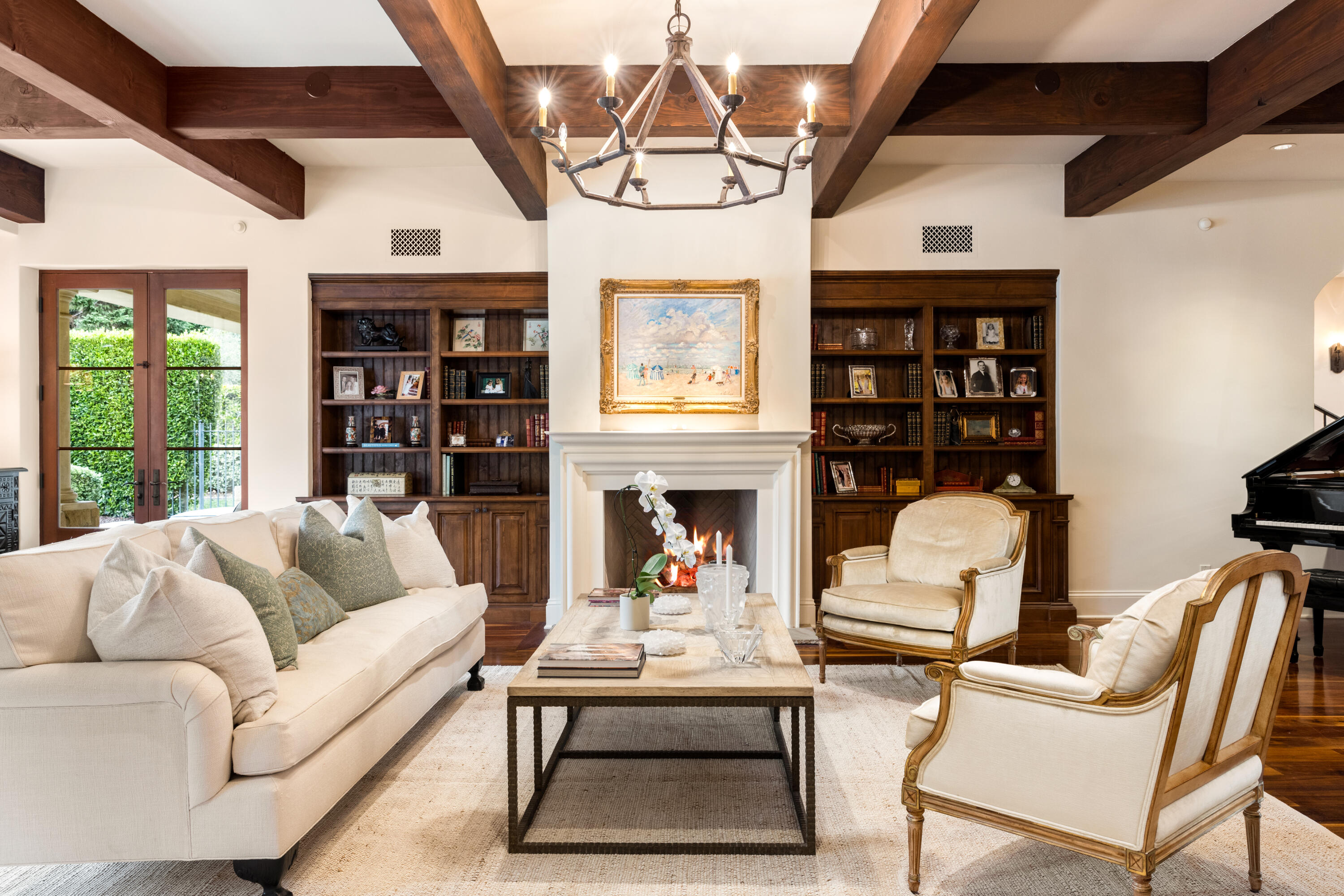 2035 Creekside Road Montecito, CA 93108 - Photo 10 of 60 a living room with furniture a fireplace and a chandelier