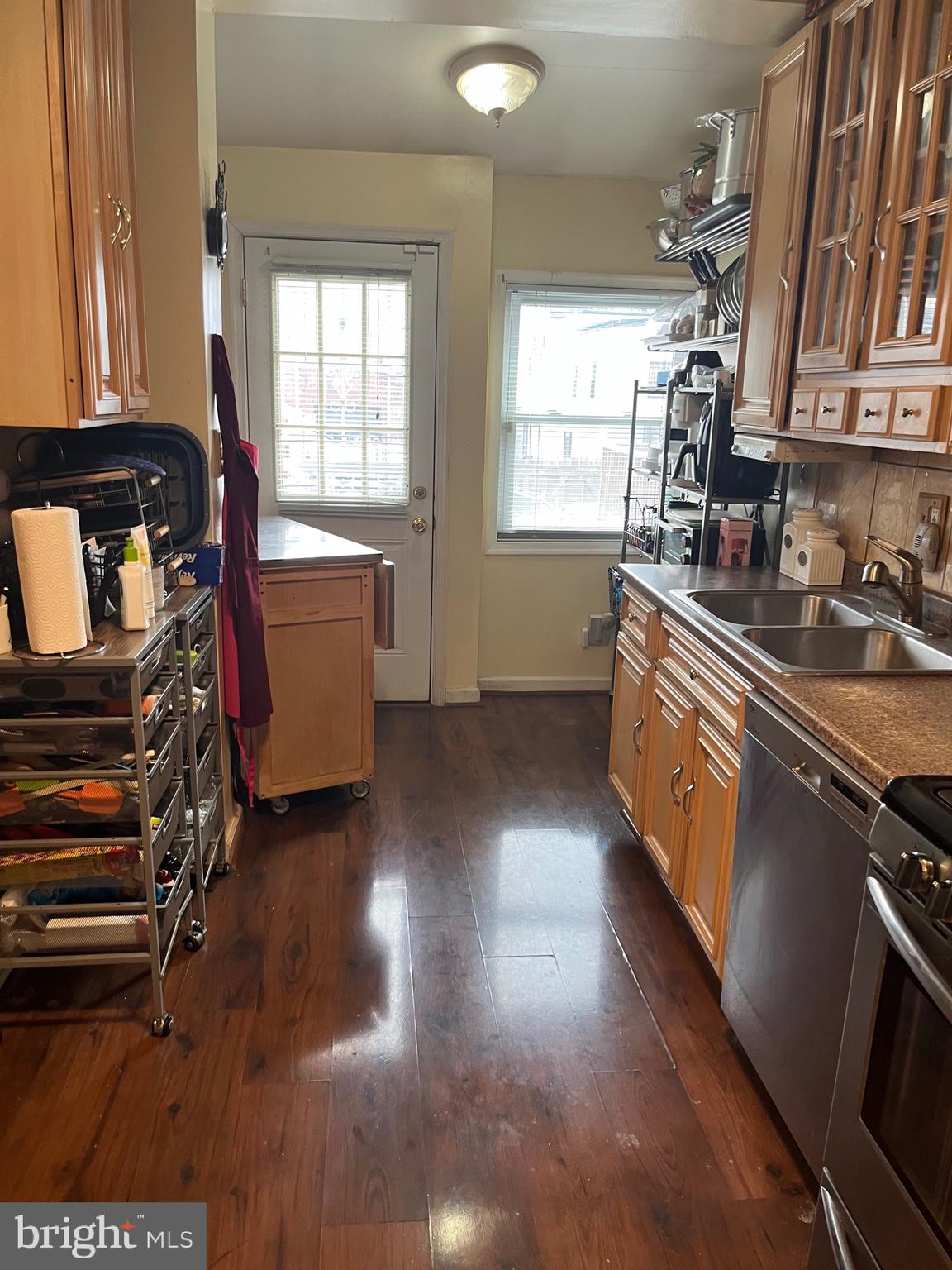 613 K Street Northeast Washington, DC 20002 - Photo 11 of 33 a kitchen with granite countertop a stove a sink and a refrigerator