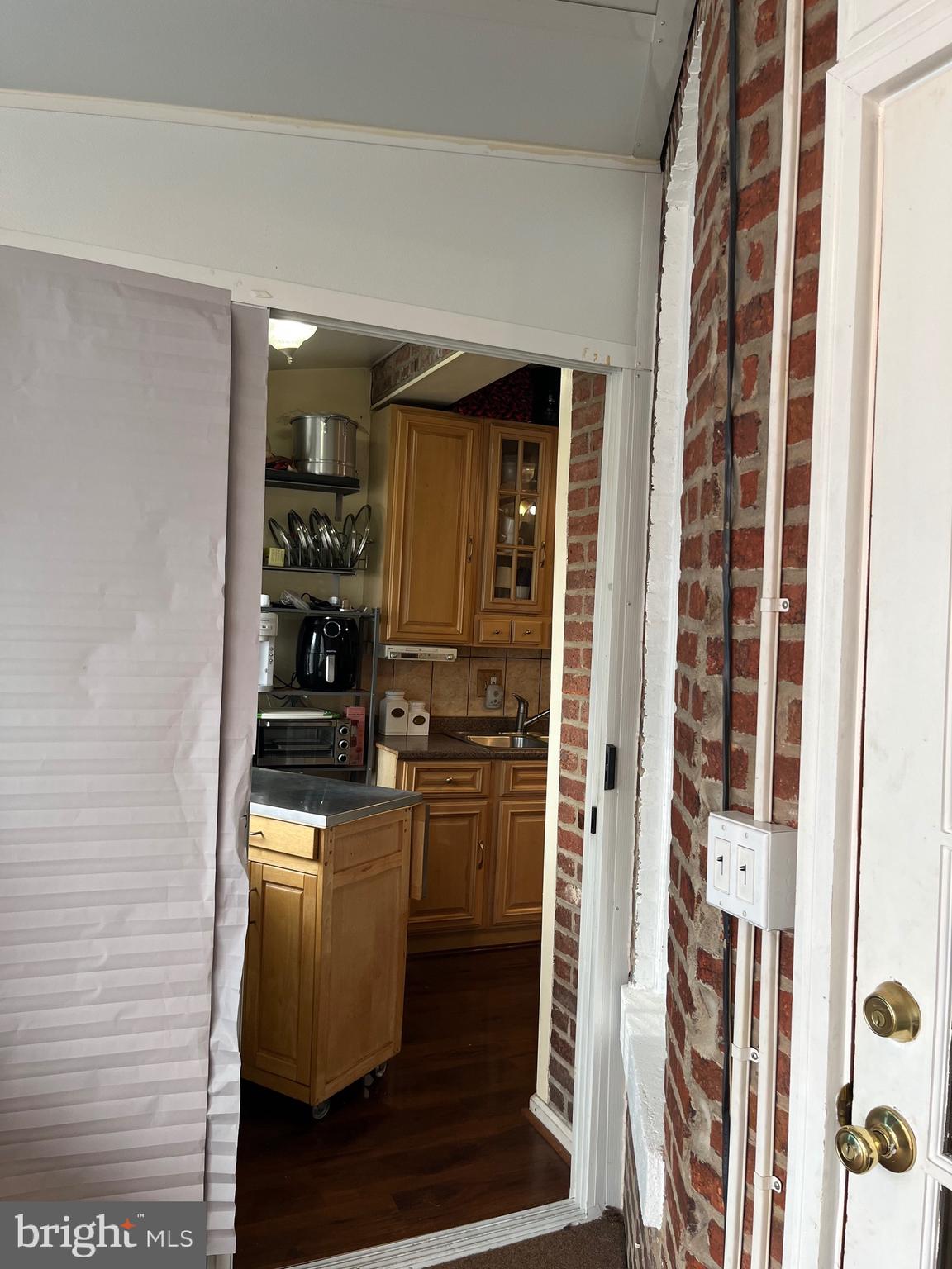 613 K Street Northeast Washington, DC 20002 - Photo 14 of 33 a kitchen with a refrigerator and cabinets