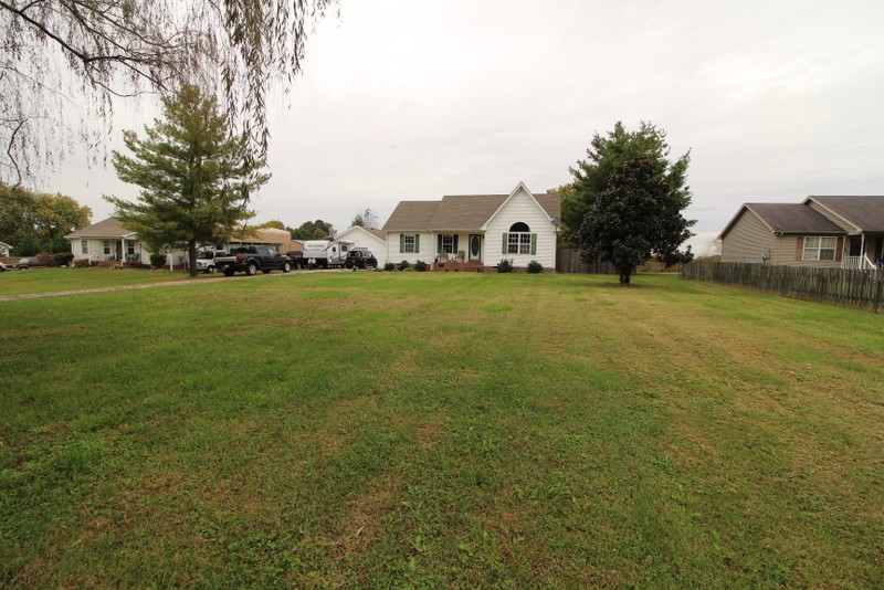 599 Lear Road Portland, TN 37148 - Photo 3 of 25 a front view of a house with a big yard