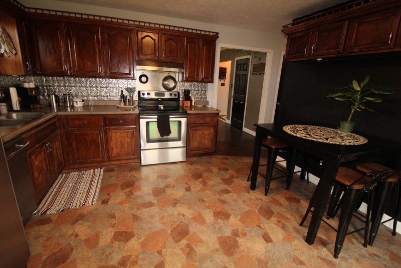 599 Lear Road Portland, TN 37148 - Photo 9 of 25 a kitchen with stainless steel appliances granite countertop a refrigerator and a stove top oven